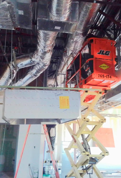 team repairing commercial AC